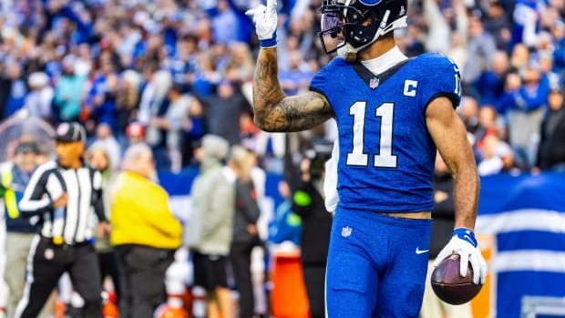 Oct 22, 2023; Indianapolis, Indiana, USA; Indianapolis Colts wide receiver Michael Pittman Jr. (11) celebrates his rushing touchdown in the second half against the Cleveland Browns at Lucas Oil Stadium. Mandatory Credit: Trevor Ruszkowski-USA TODAY Sports